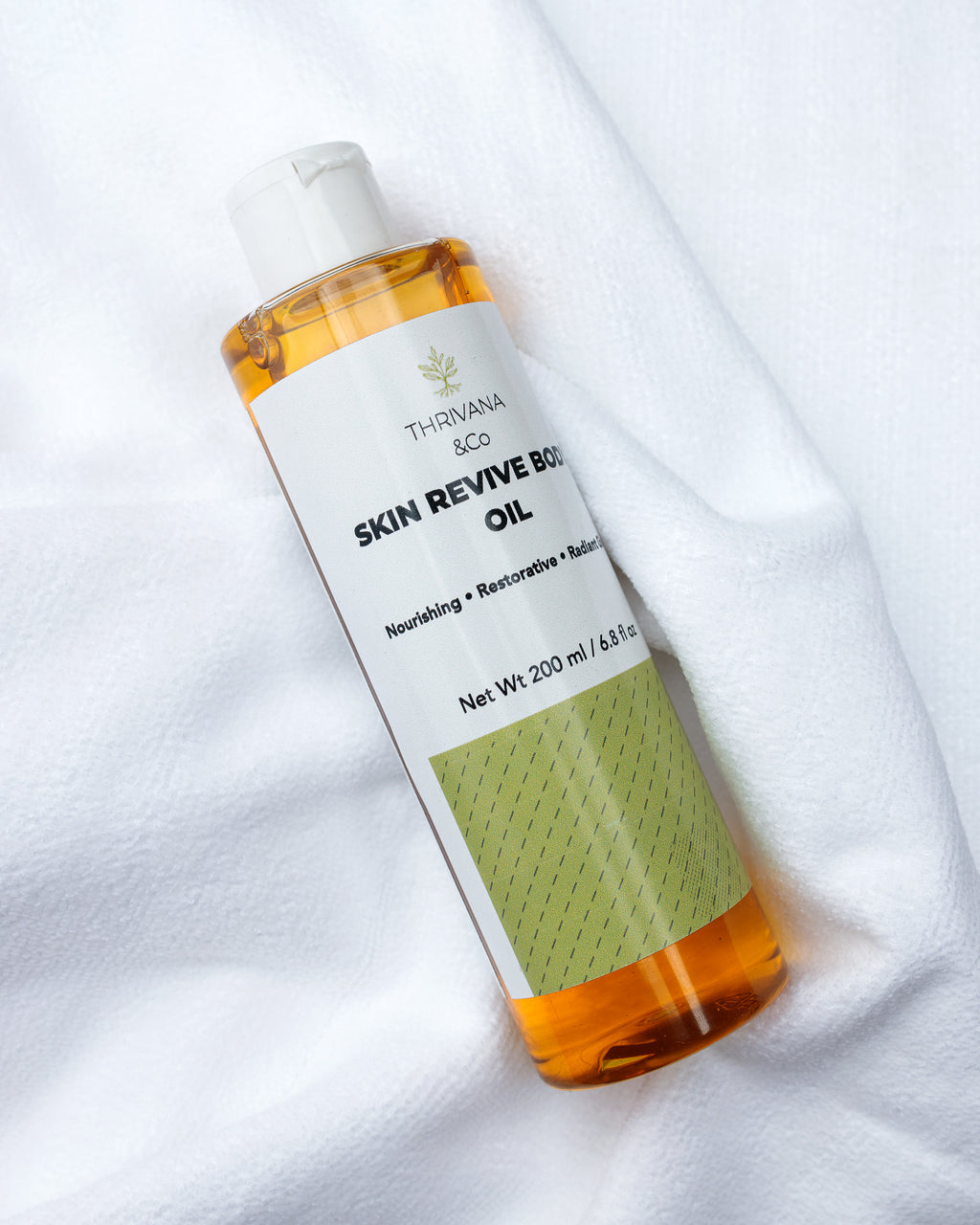 Bottle of Thrivana & Co Skin Revive Body Oil 